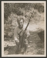 Paul Meleschuk of Auto Park posing with rifle and bayonet
